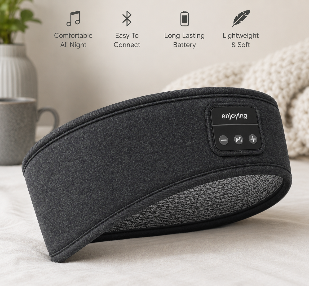 Black sleep headband with control panel on a light surface, featuring icons and text about its features.